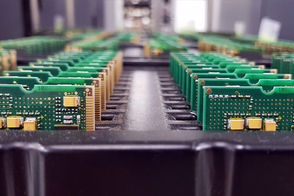 Rows of printed circuit boards in a tray